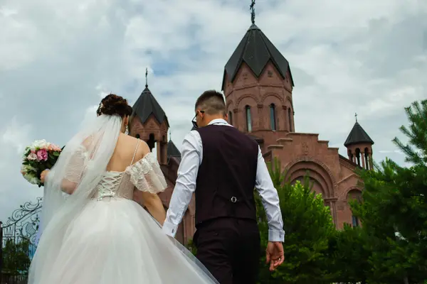 a bride and groom walking toward a church from Concordia Lutheran Church houston in Houston, TX - church near me
